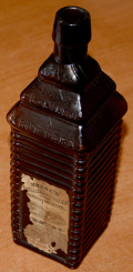 DRAKE’S 1860 PLANTATION X BITTERS BOTTLE, PATENTED 1862, WITH REMAINS OF LABELS