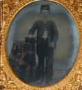 SIXTH PLATE AMBROTYPE OF YOUNG SCHOOL BOY OR CADET IN UNION CASE WITH “FIREMAN” MOTIF