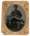 QUARTER-PLATE TINTYPE OF A JOVIAL SOLDIER SMOKING A MEERSCHAUM PIPE 