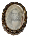 DAGUERREIAN BROOCH WITH SMILING PORTRAIT AND LOCK OF HAIR